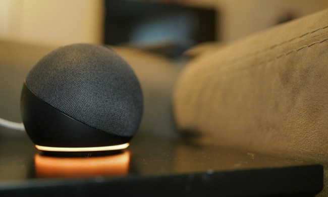 Amazon Echo Dot (4th Gen) on table.